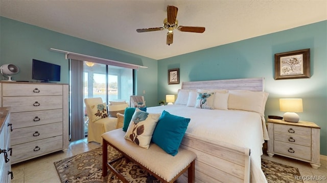 bedroom with ceiling fan and light tile patterned floors