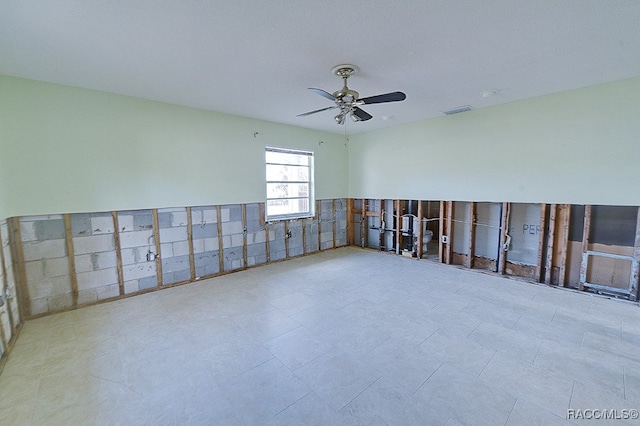 spare room with ceiling fan and a textured ceiling