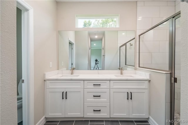 9262 N Alpinia Dr, Citrus Springs, FL 34434 - bathroom with double vanity, a shower stall, and baseboards