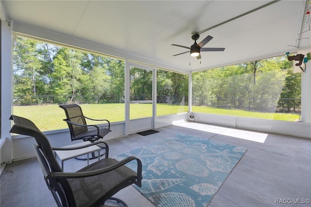 1435 W Adele Ct, Citrus Springs, FL 34434 - sunroom / solarium featuring a ceiling fan and view of wooded area
