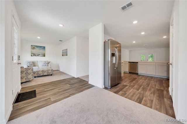 1435 W Adele Ct, Citrus Springs, FL 34434 - living room featuring wood finished floors and recessed lighting