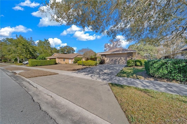 view of front of property featuring a garage and driveway