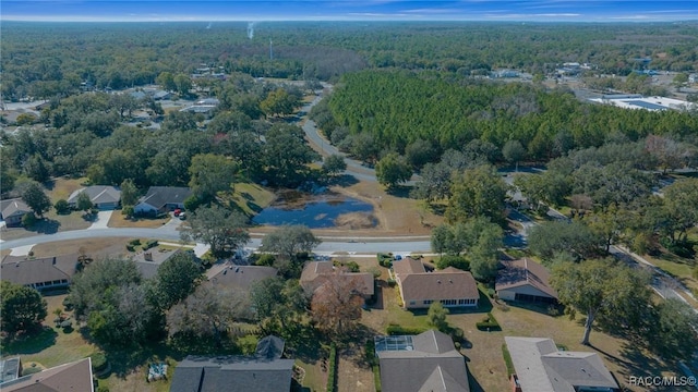 birds eye view of property with a residential view and a forest view