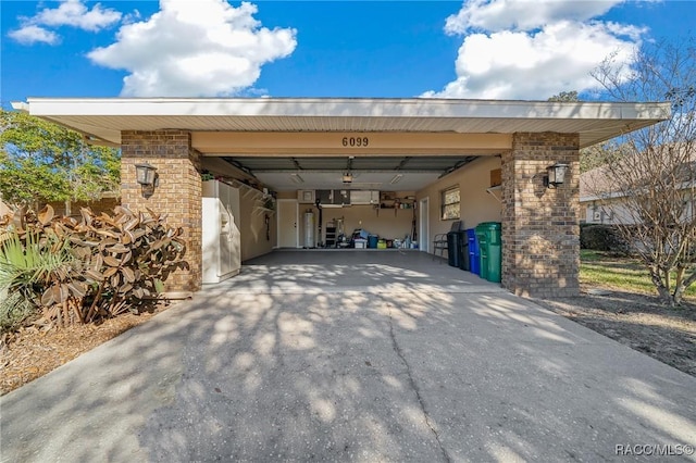 view of parking / parking lot with a garage