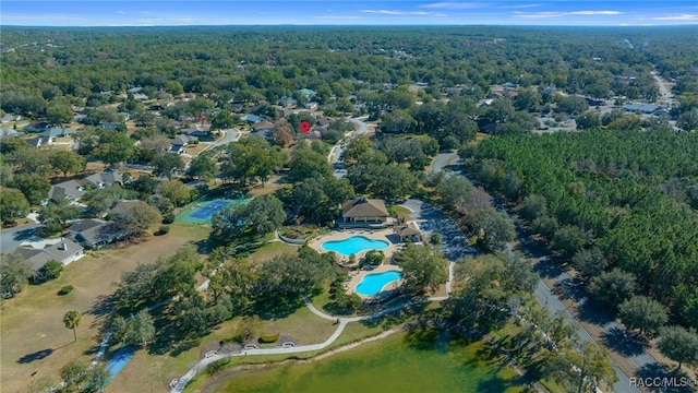 birds eye view of property with a forest view