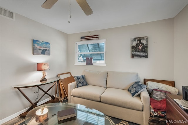 living room with hardwood / wood-style floors and ceiling fan