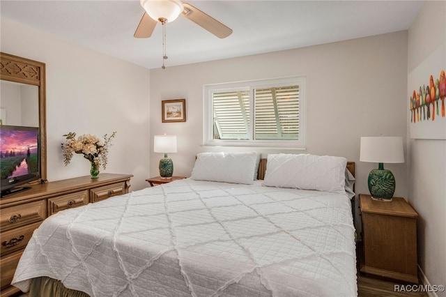 bedroom featuring wood-type flooring and ceiling fan