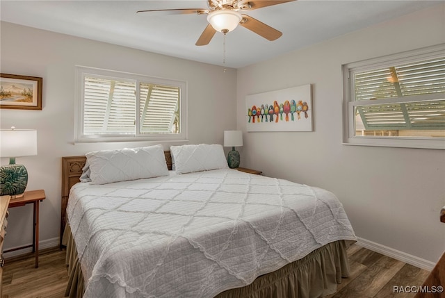 bedroom with hardwood / wood-style floors and ceiling fan