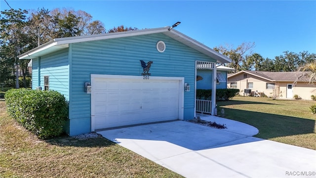 exterior space featuring a garage and a front lawn