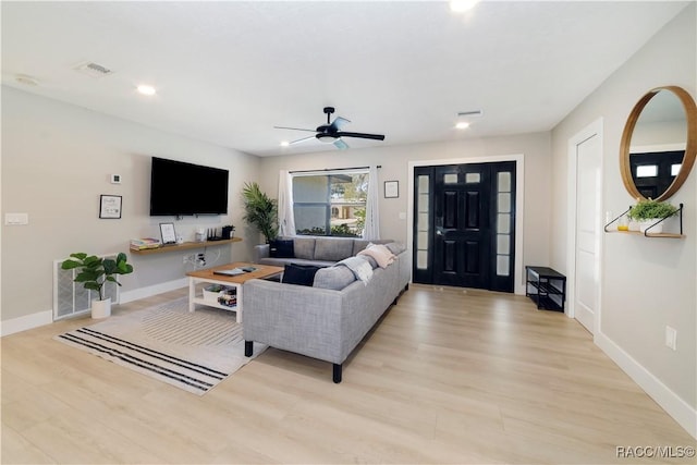 living area with visible vents, baseboards, ceiling fan, recessed lighting, and light wood-style flooring