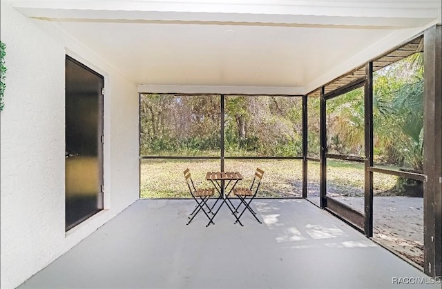unfurnished sunroom featuring plenty of natural light