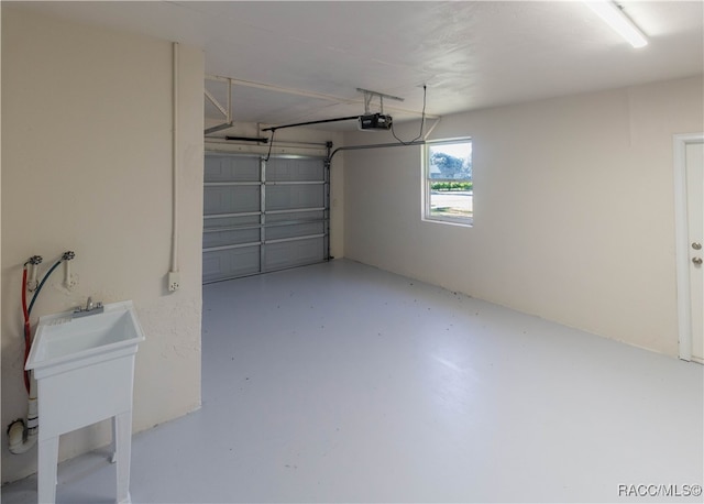 garage with sink and a garage door opener