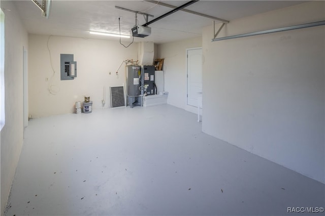 garage with electric panel, water heater, and a garage door opener