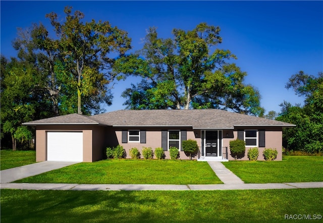 single story home featuring a garage and a front yard