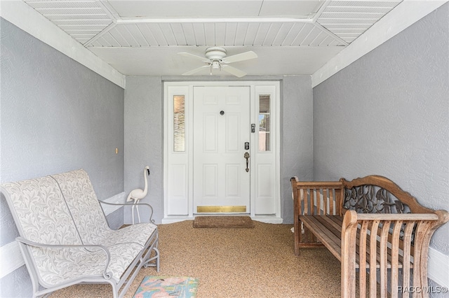 entrance to property featuring ceiling fan