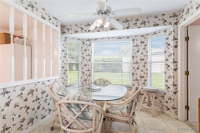 dining area with light carpet and ceiling fan