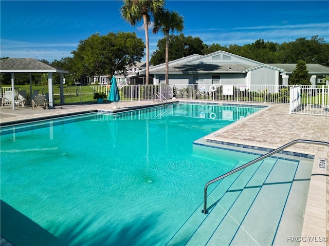 view of pool featuring a gazebo and a patio area