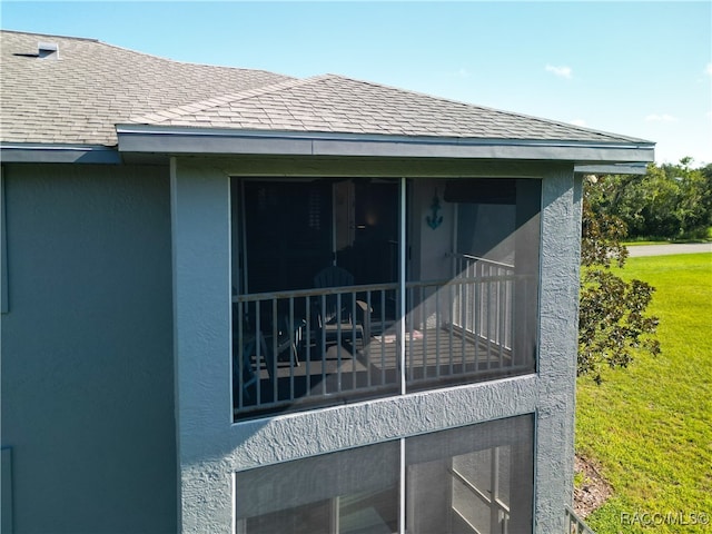 view of side of property with a sunroom