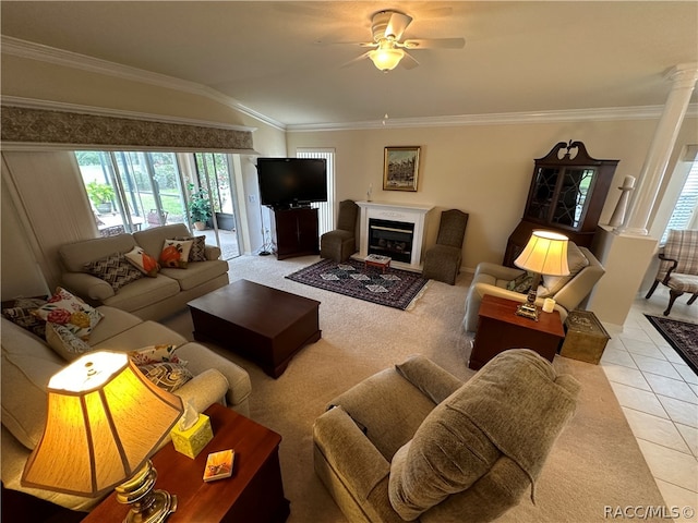 tiled living room with vaulted ceiling, ceiling fan, and ornamental molding