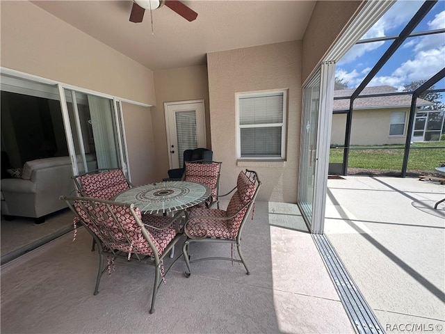 sunroom / solarium with ceiling fan