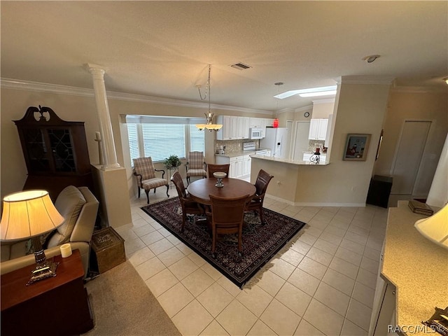 dining space featuring lofted ceiling, light tile patterned floors, crown molding, and decorative columns