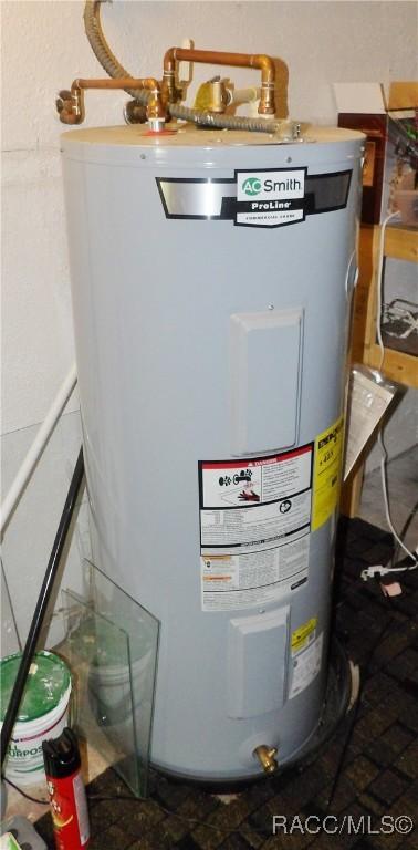 127 N Braemar Dr, Inverness, FL 34450 - utility room with electric water heater