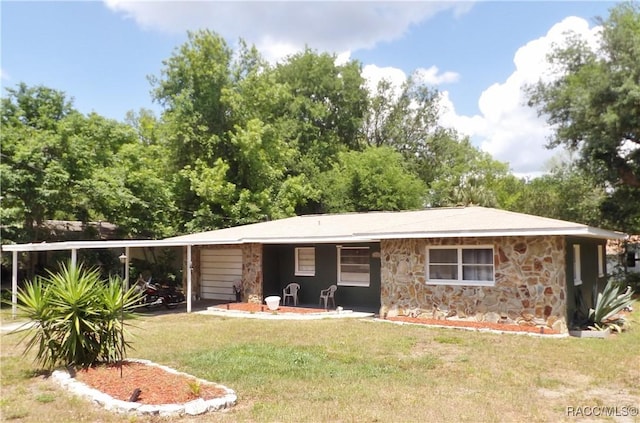 127 N Braemar Dr, Inverness, FL 34450 - exterior space featuring a front lawn and stone siding