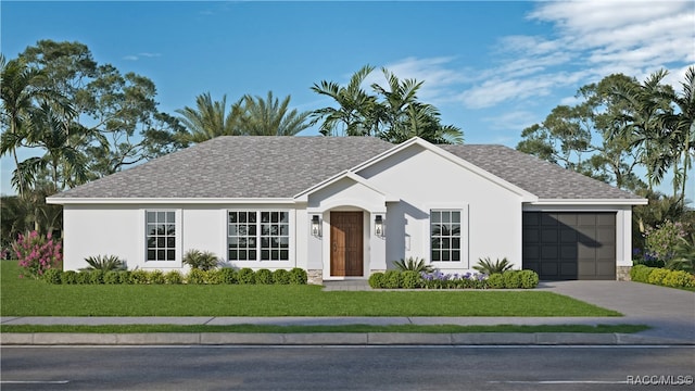 ranch-style house featuring a front yard and a garage
