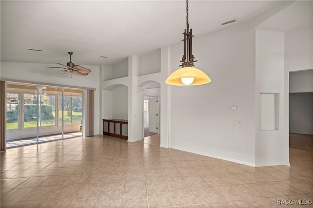 unfurnished room featuring light tile patterned flooring, high vaulted ceiling, and ceiling fan