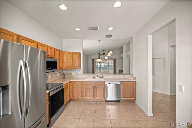 kitchen featuring appliances with stainless steel finishes, decorative light fixtures, sink, light tile patterned flooring, and decorative backsplash