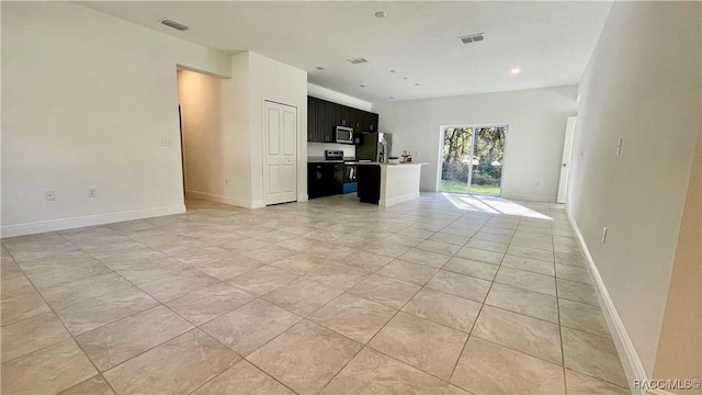 unfurnished living room featuring light tile patterned floors, baseboards, and visible vents