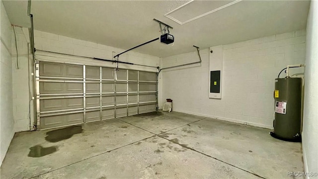 garage featuring concrete block wall, electric panel, a garage door opener, and electric water heater