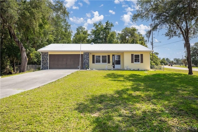 835 S Rosemary Pt, Homosassa, FL 34448 - ranch-style home with a garage, concrete driveway, metal roof, and stucco siding