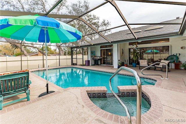 view of swimming pool featuring area for grilling, glass enclosure, and a patio area