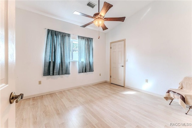 unfurnished room featuring ceiling fan, lofted ceiling, crown molding, and light hardwood / wood-style floors