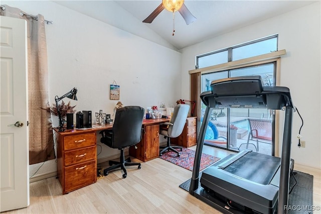 office space featuring vaulted ceiling, ceiling fan, and light hardwood / wood-style flooring