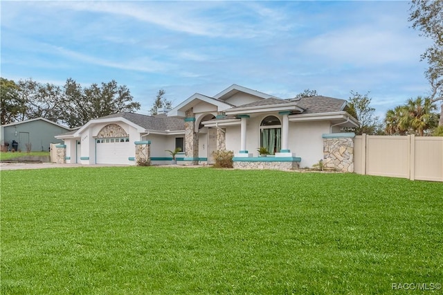 ranch-style house with a garage and a front lawn