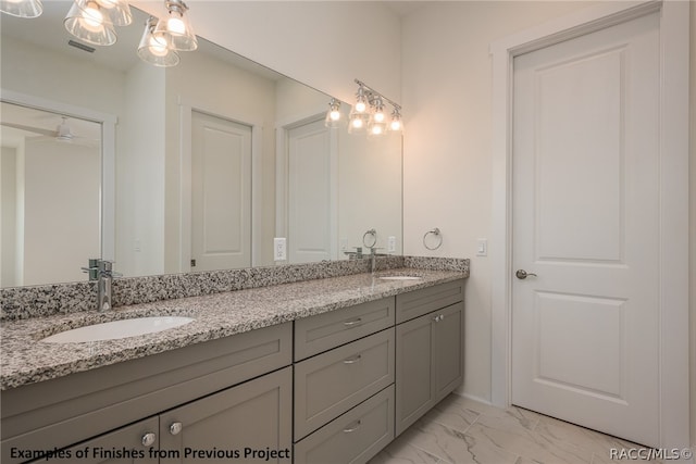 bathroom with ceiling fan and vanity