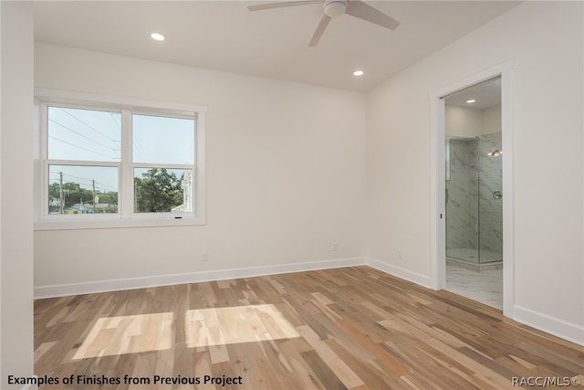 spare room featuring ceiling fan and light hardwood / wood-style floors