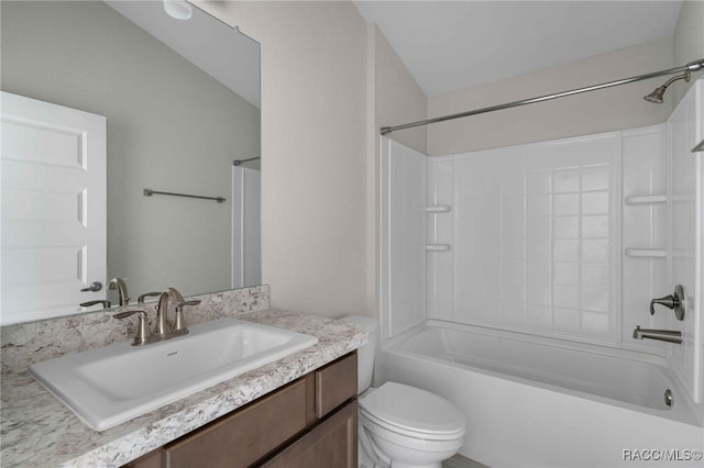 full bathroom featuring vanity, bathtub / shower combination, and toilet