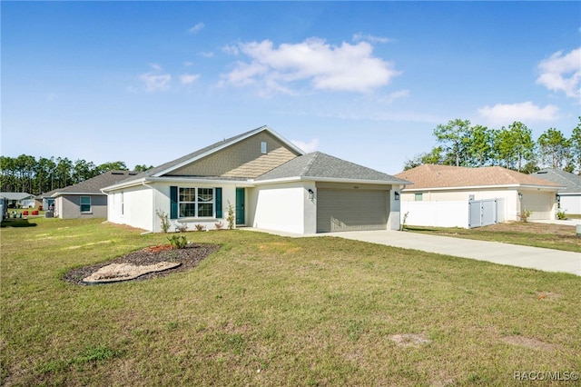 view of front of property with a garage and a front yard