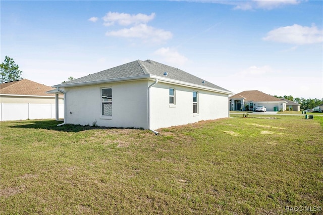 view of property exterior with a yard