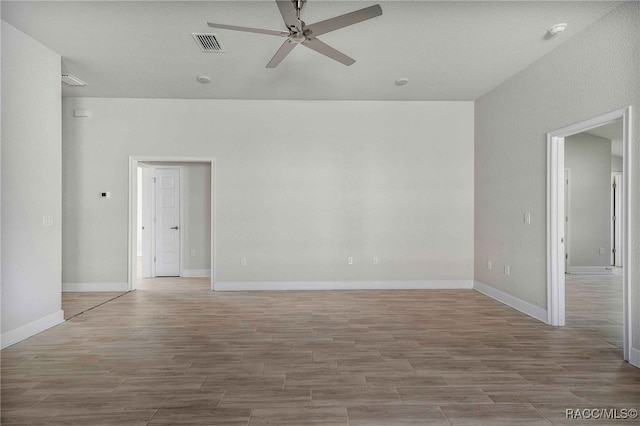 empty room featuring light hardwood / wood-style floors and ceiling fan