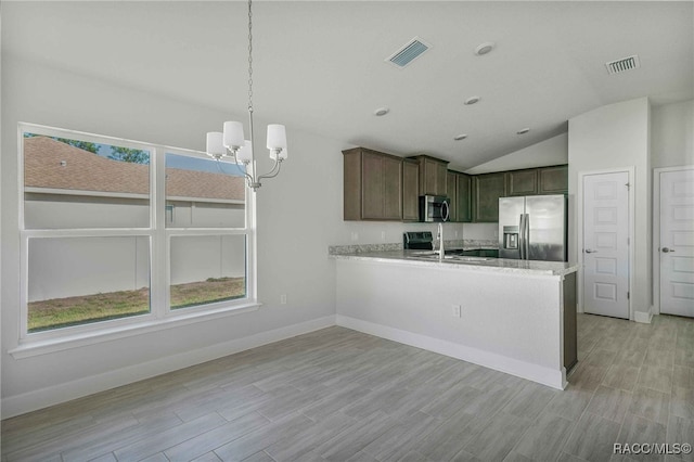 kitchen with lofted ceiling, hanging light fixtures, dark brown cabinets, stainless steel appliances, and kitchen peninsula