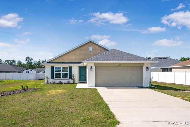 view of front facade featuring a garage and a front yard