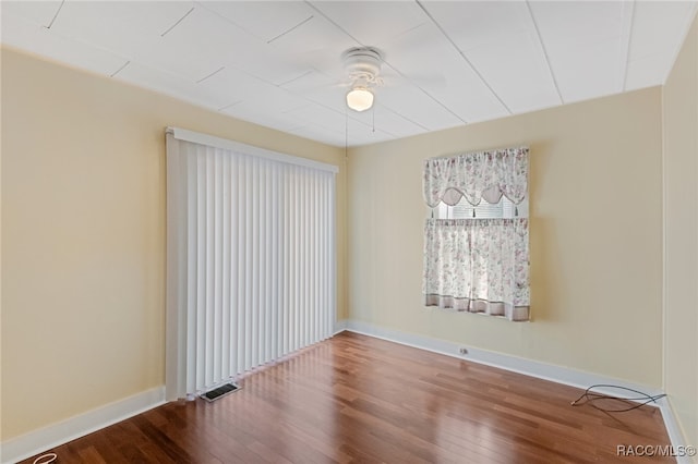 spare room featuring hardwood / wood-style floors and ceiling fan