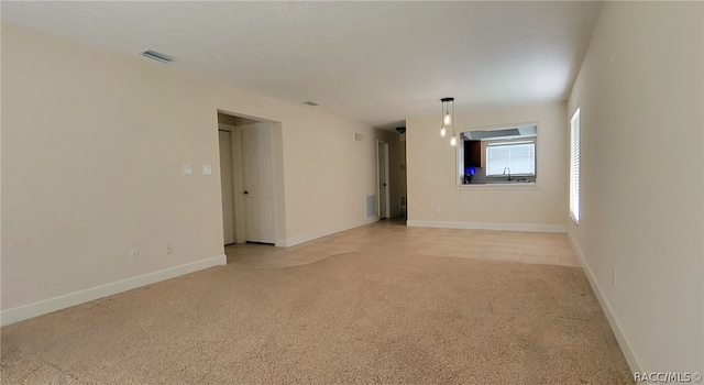 empty room with light carpet and sink