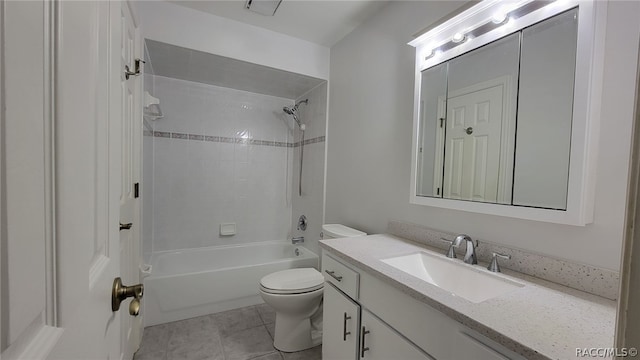 full bathroom with vanity, tiled shower / bath combo, toilet, and tile patterned flooring