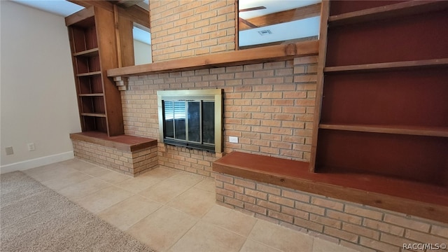 unfurnished living room with light tile patterned flooring