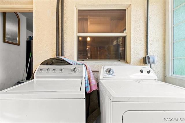 washroom featuring washing machine and dryer